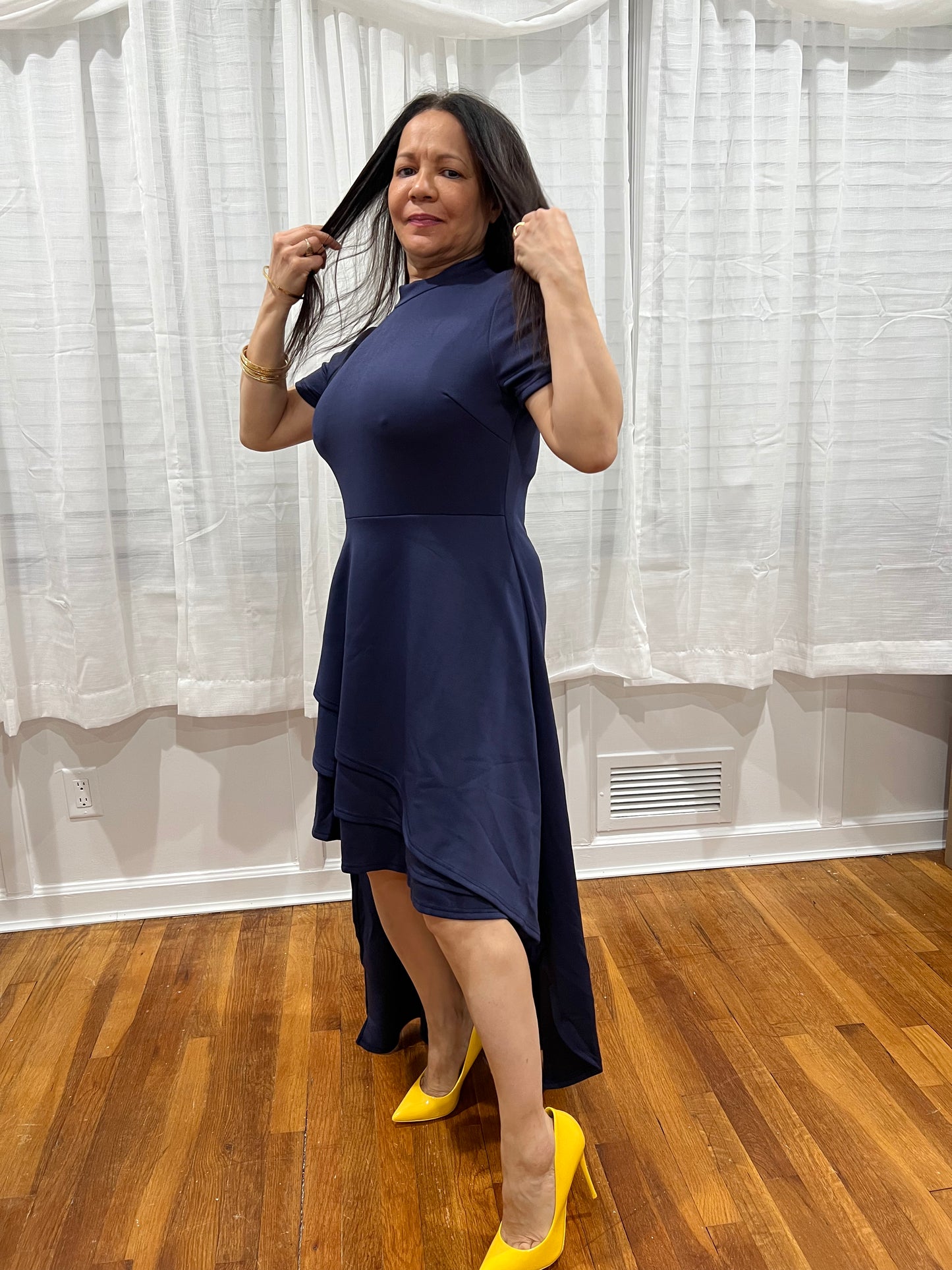 DRESS SPRING SUMMER, WINTER AND ALL YEAR AROUND DRESS. DARK BLUE. LONG ON THE BACK AND SHORT AT THE FRONT. SHORT SLEEVE.CONFORTABLE.