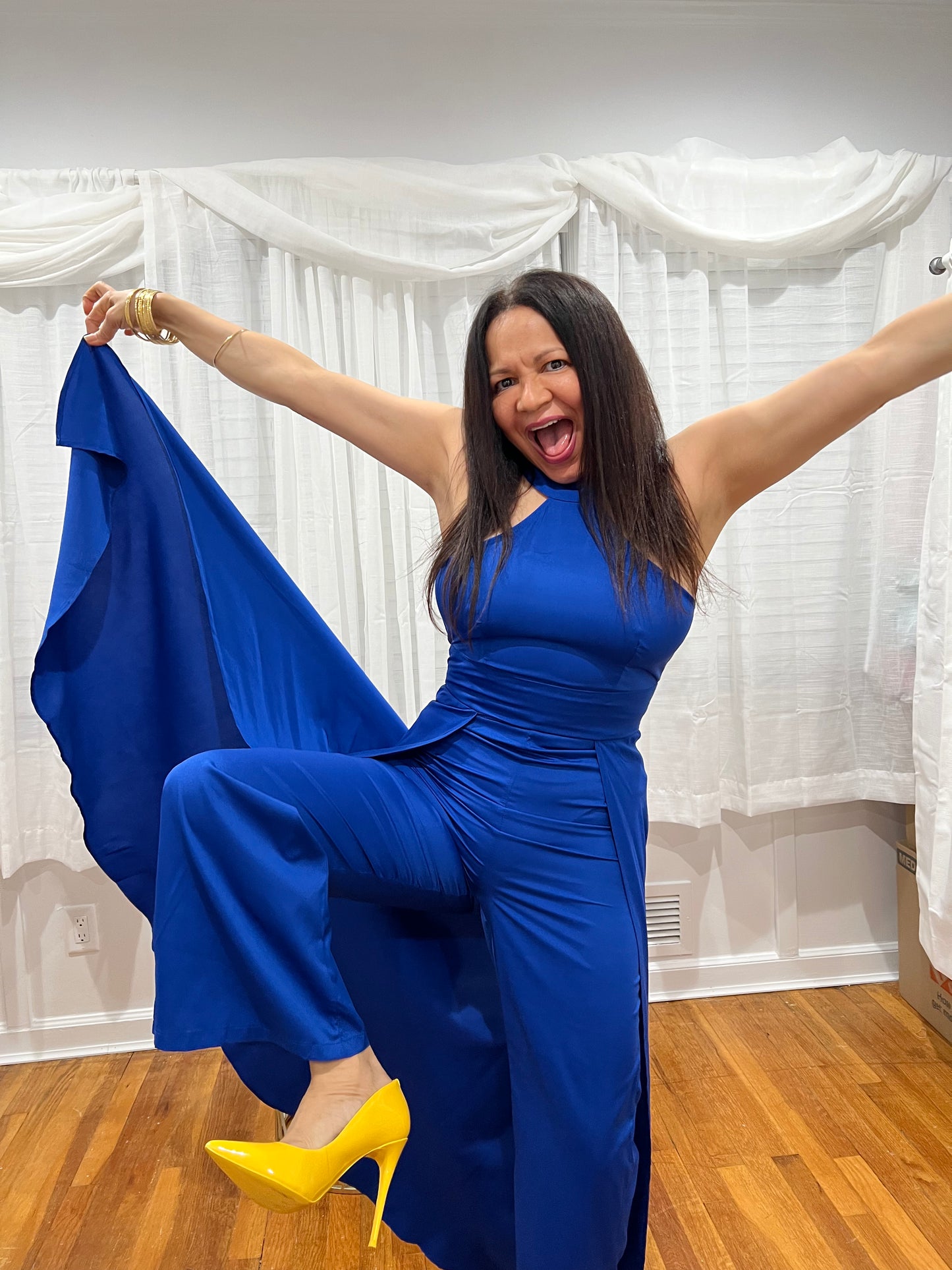 JUMPSUIT BLACK ELEGANT JUMPSUIT, NO SLEEVES, LONG PANTS WITH ATTACHED SKIRT UNIQUE STYLE ON THE BACK.