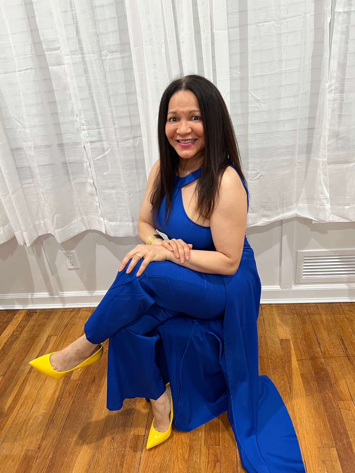 JUMPSUIT BLACK ELEGANT JUMPSUIT, NO SLEEVES, LONG PANTS WITH ATTACHED SKIRT UNIQUE STYLE ON THE BACK.