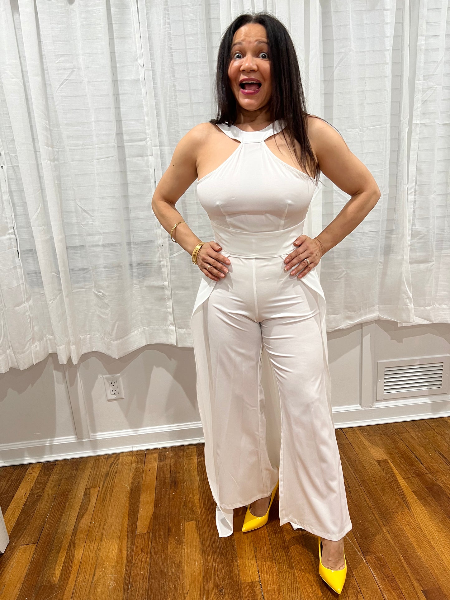 JUMPSUIT BLACK ELEGANT JUMPSUIT, NO SLEEVES, LONG PANTS WITH ATTACHED SKIRT UNIQUE STYLE ON THE BACK.