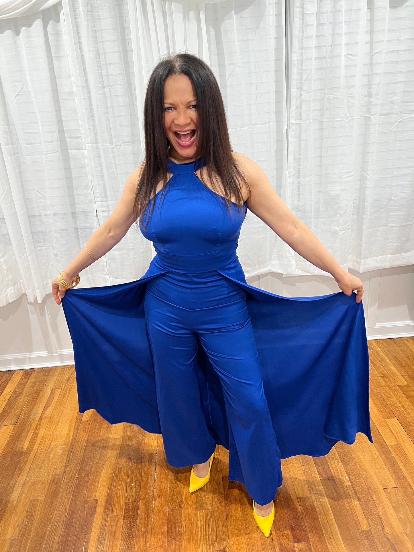 JUMPSUIT BLACK ELEGANT JUMPSUIT, NO SLEEVES, LONG PANTS WITH ATTACHED SKIRT UNIQUE STYLE ON THE BACK.