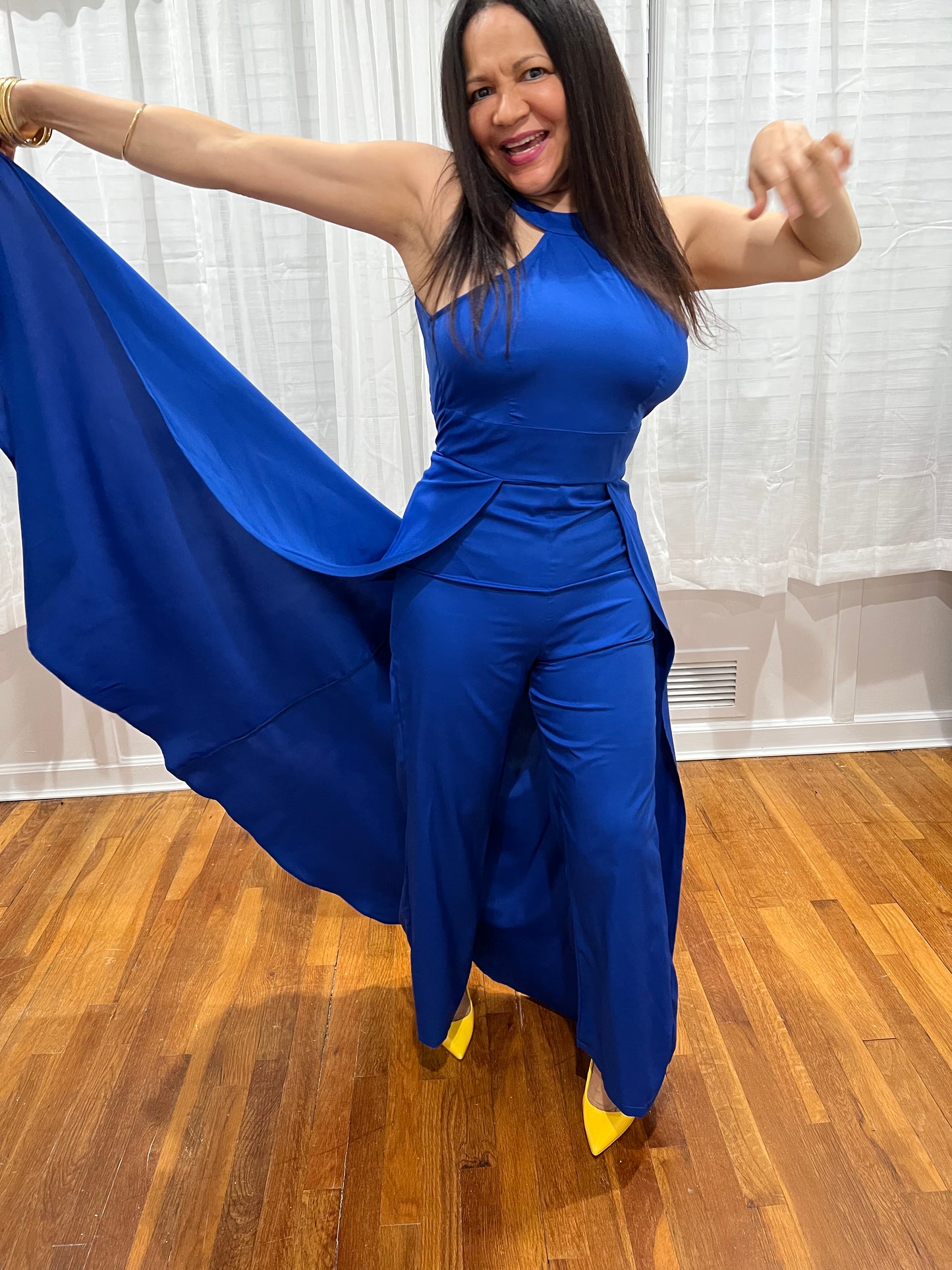 JUMPSUIT BLACK ELEGANT JUMPSUIT, NO SLEEVES, LONG PANTS WITH ATTACHED SKIRT UNIQUE STYLE ON THE BACK.